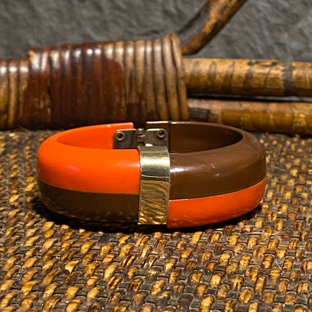 Early 20th century celluloid hinged bangle,layered chunky oval,orange/brown